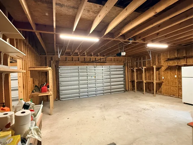 a view of empty room with wooden ceiling