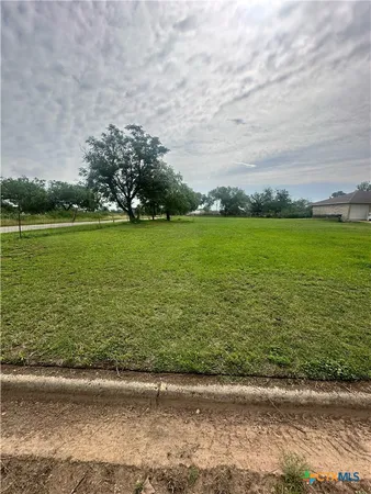 a view of a lake with a yard