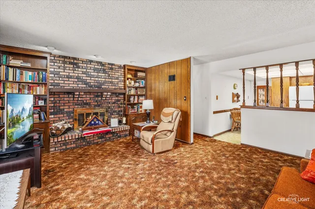 a bedroom with furniture and a book shelf