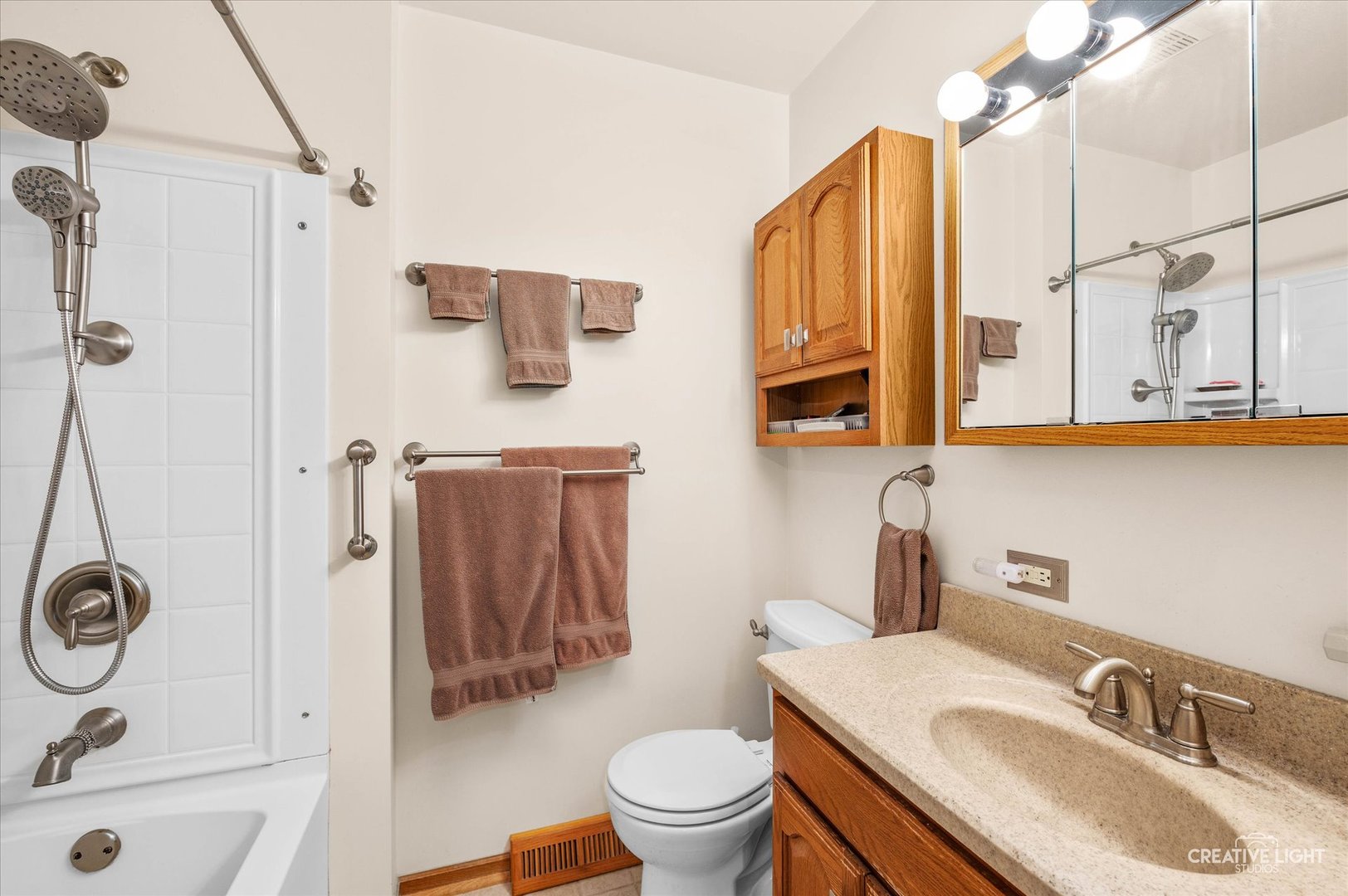 15304 South Indian Boundary Line Road Plainfield, IL 60544 - Photo 10 of 28 a bathroom with a sink toilet and shower