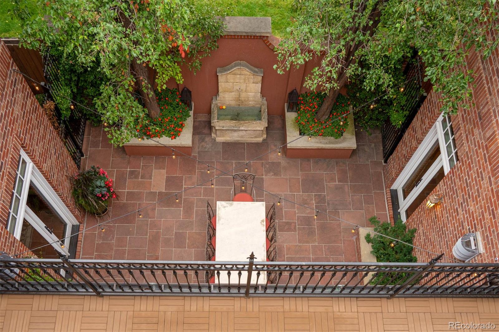 445 Madison Street Denver, CO 80206 - Photo 14 of 50 a front view of a house with garden