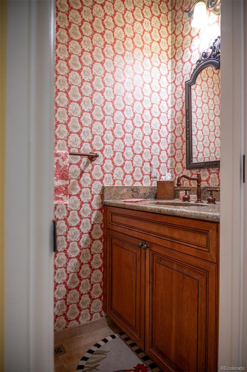 445 Madison Street Denver, CO 80206 - Photo 16 of 50 a bathroom with a sink a vanity and a shower curtain