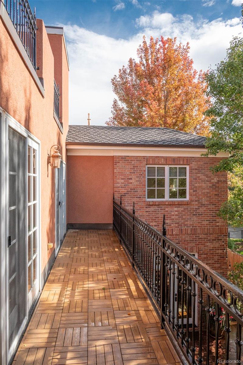 445 Madison Street Denver, CO 80206 - Photo 21 of 50 a view of balcony with wooden floor and fence