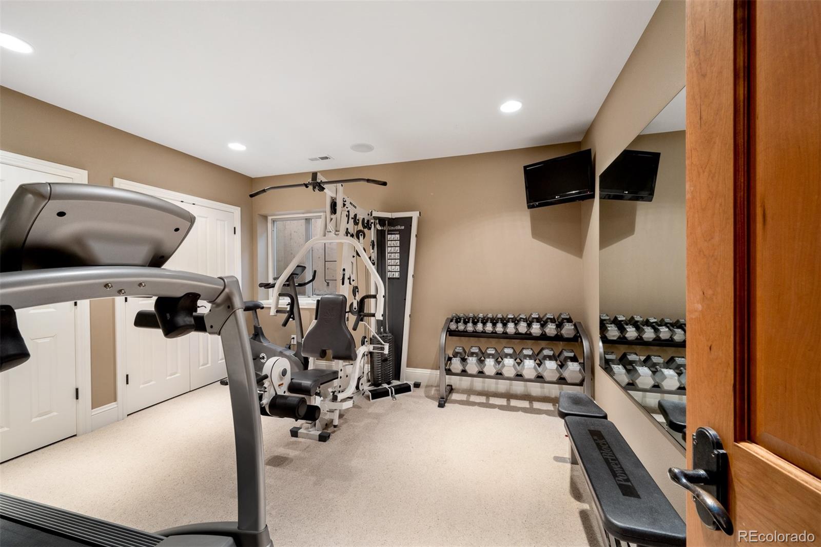 445 Madison Street Denver, CO 80206 - Photo 42 of 50 a view of a room with gym equipment