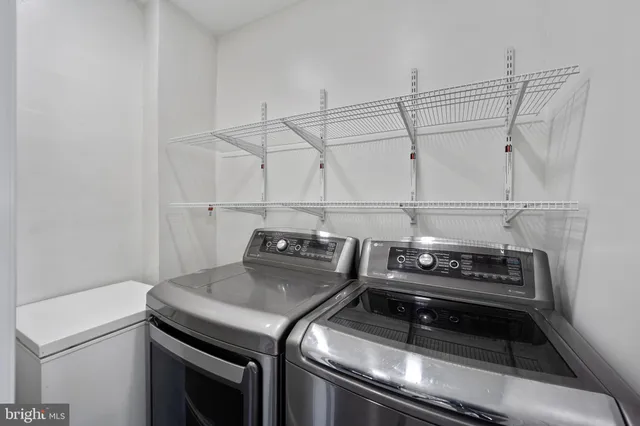a stove top oven sitting inside of a kitchen