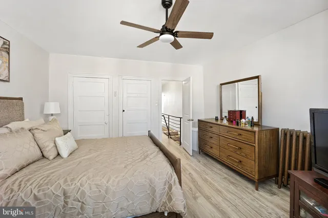 a bed room with a bed and a chandelier