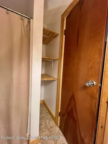 a bathroom with a shower and a tub