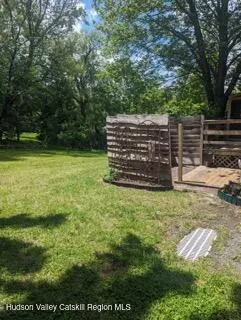 a view of a backyard with pathway