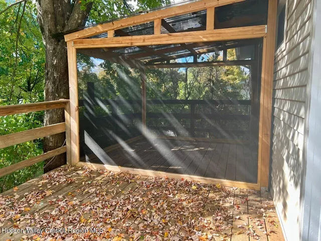 a view of a house with a tree