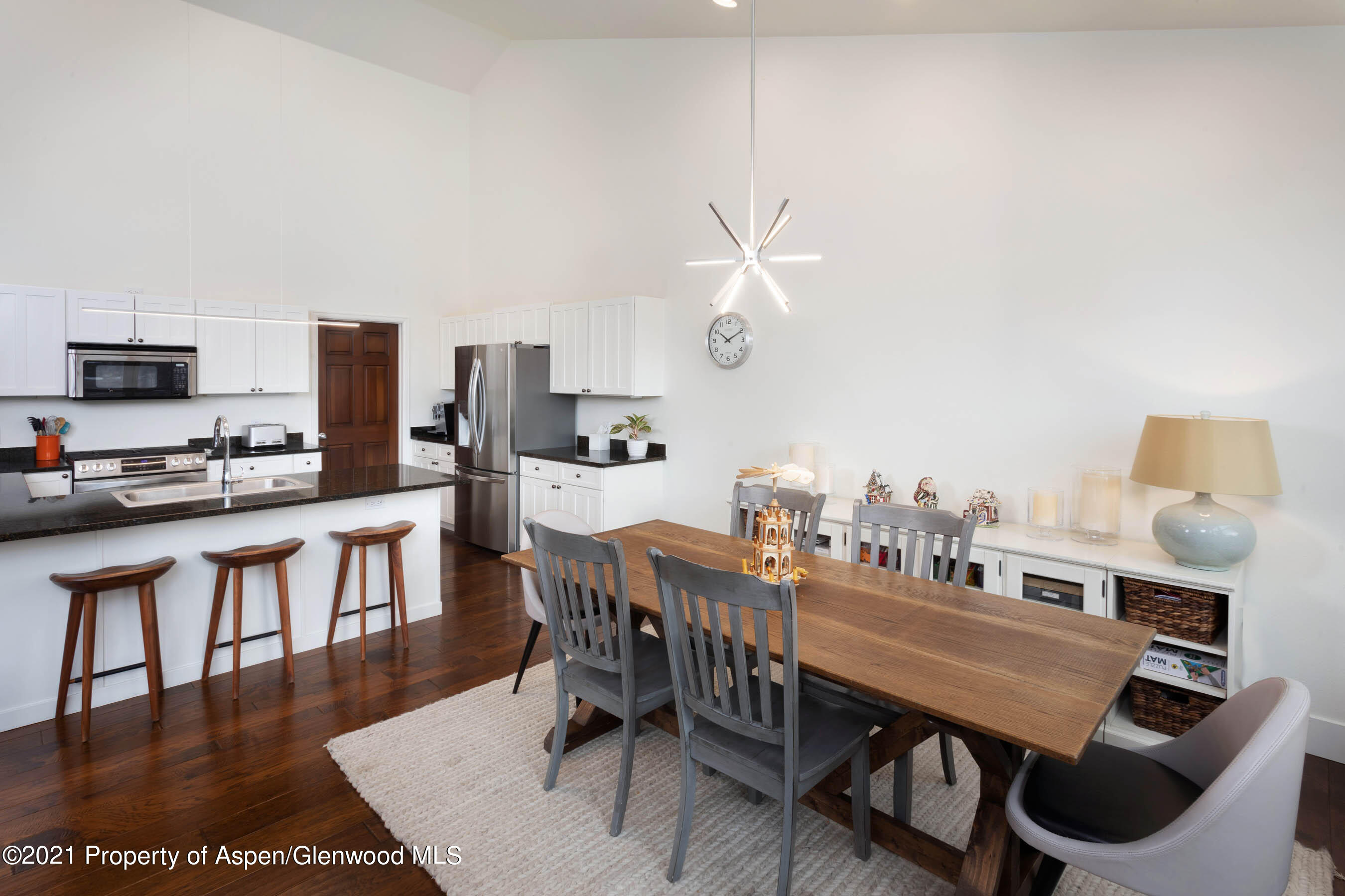 614 Evans Court Basalt, CO 81621 - Photo 13 of 34 a dining room with furniture and wooden floor