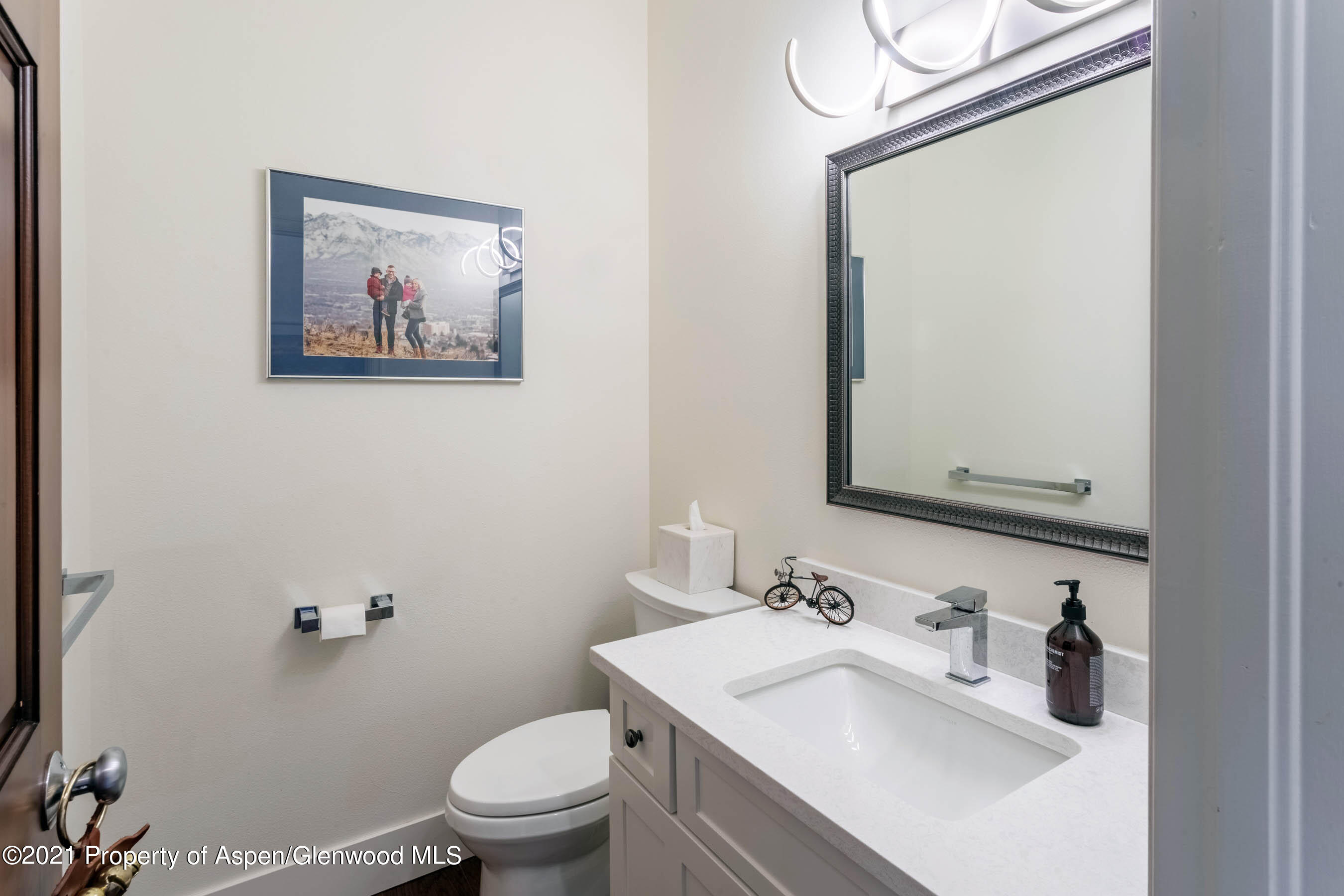 614 Evans Court Basalt, CO 81621 - Photo 18 of 34 a bathroom with a sink vanity mirror and toilet