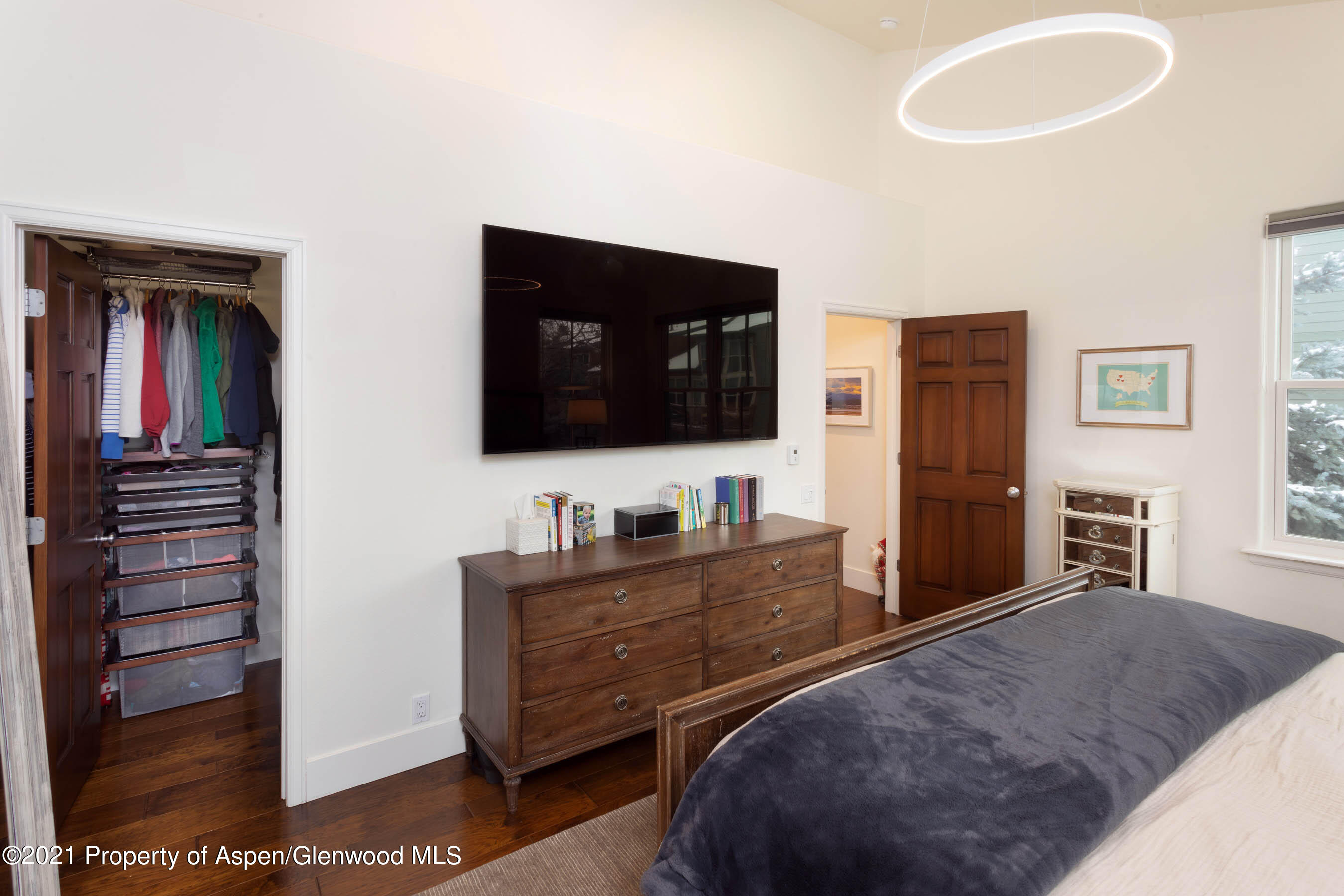 614 Evans Court Basalt, CO 81621 - Photo 21 of 34 a bedroom with a bed and a flat screen tv