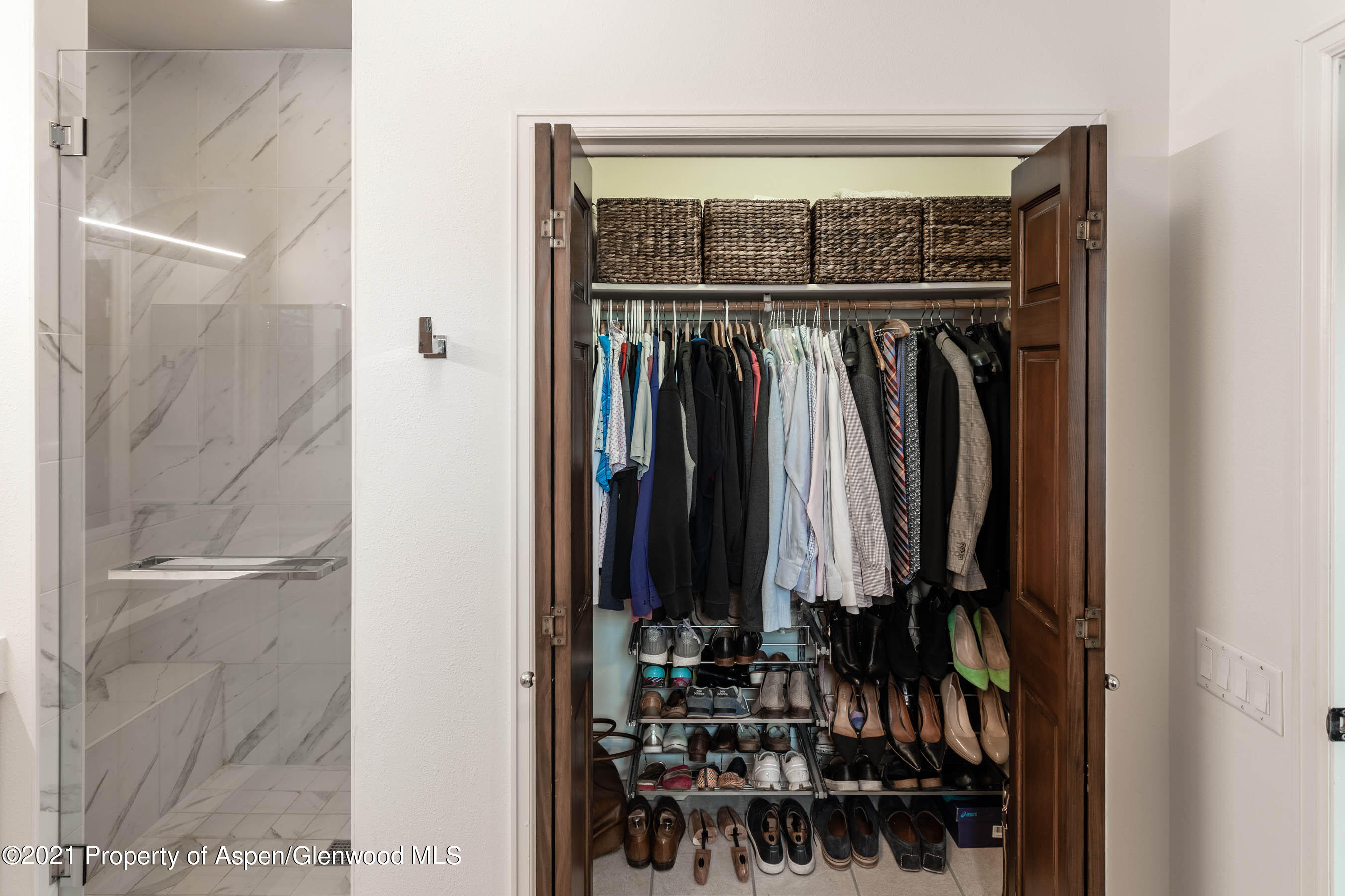 614 Evans Court Basalt, CO 81621 - Photo 24 of 34 a view of walk in closet with clothes and shoes