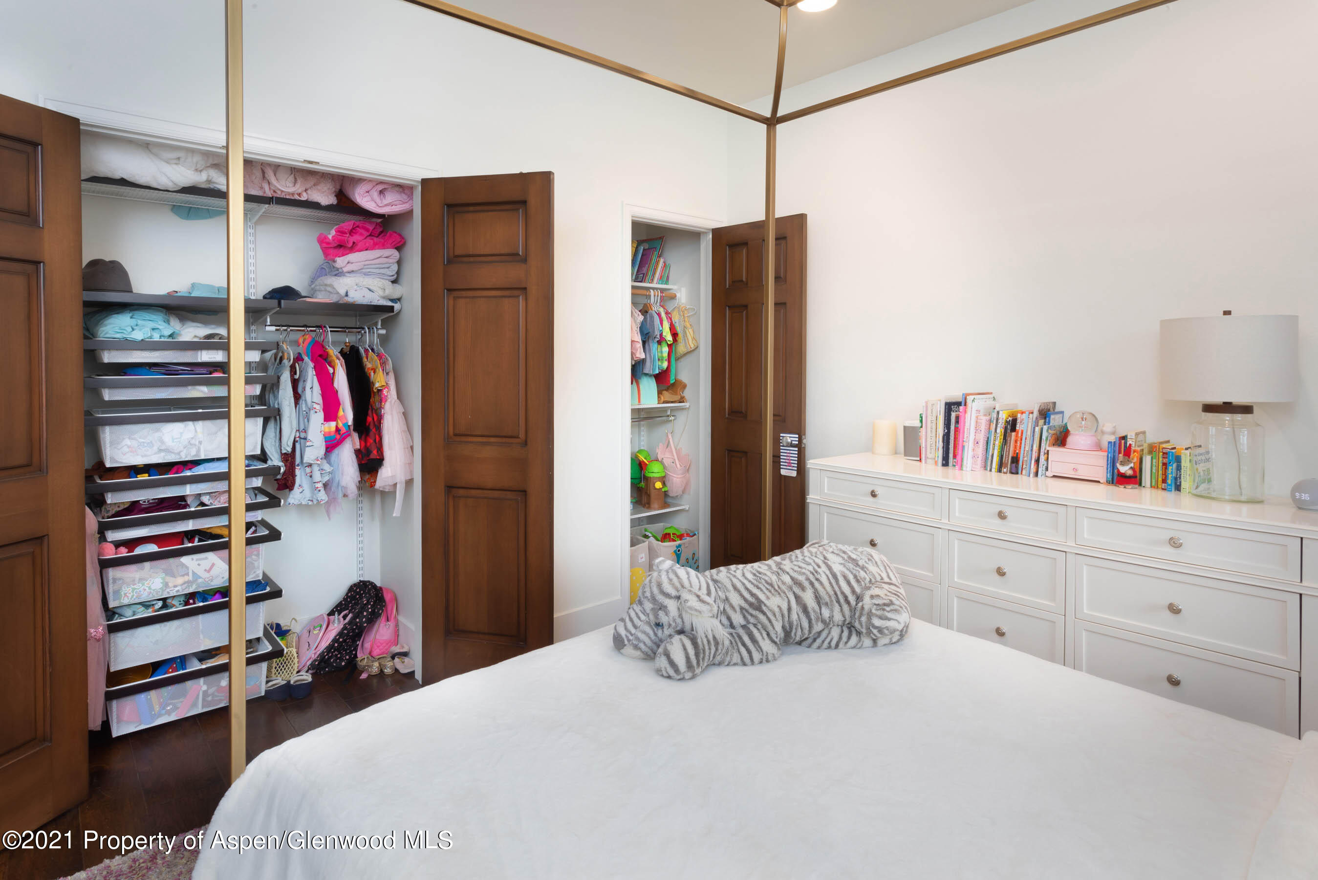 614 Evans Court Basalt, CO 81621 - Photo 27 of 34 a bedroom with a bed and a refrigerator