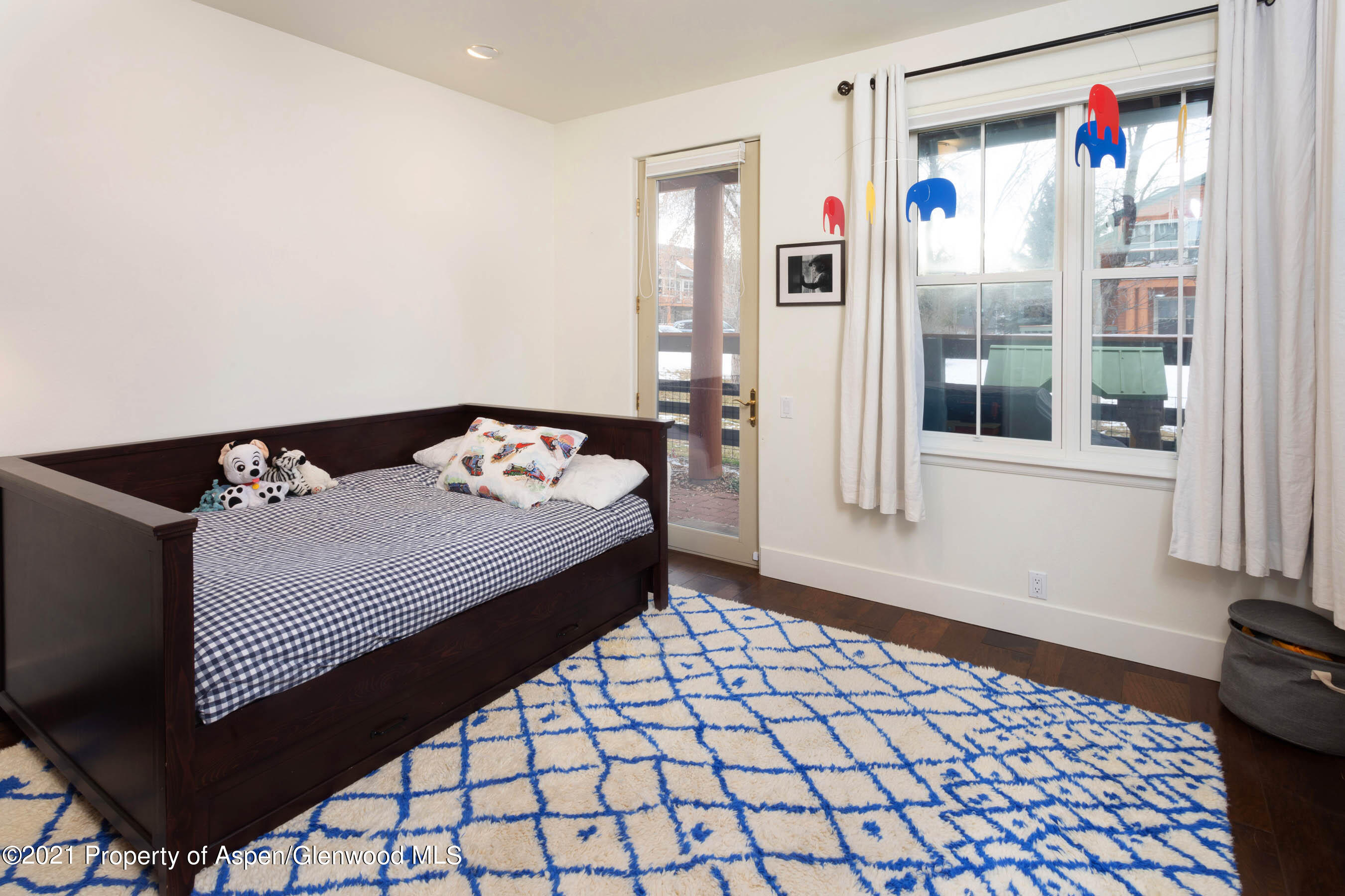 614 Evans Court Basalt, CO 81621 - Photo 28 of 34 a bedroom with a bed and window