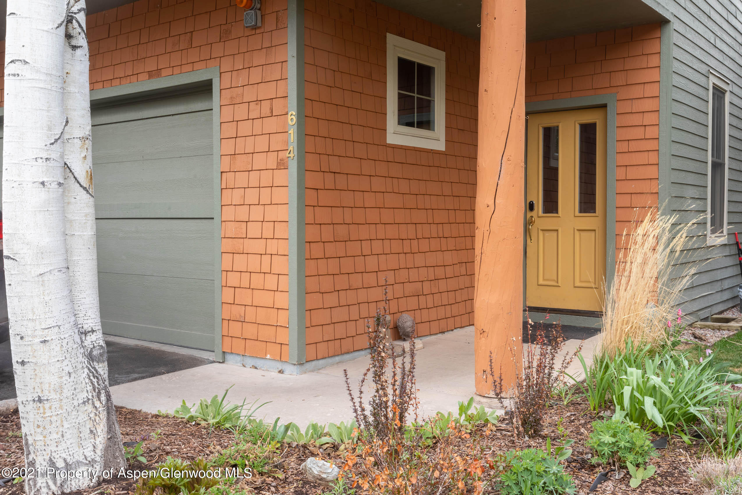 614 Evans Court Basalt, CO 81621 - Photo 6 of 34 a brick house with a tree in front