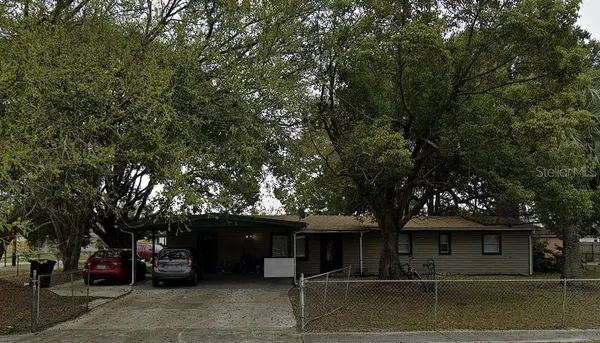 a view of a car park in front of house