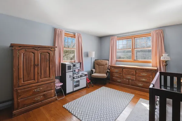 a room with furniture closet and flat screen tv