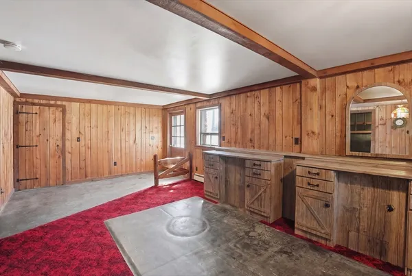 a view of a kitchen with a sink and cabinets