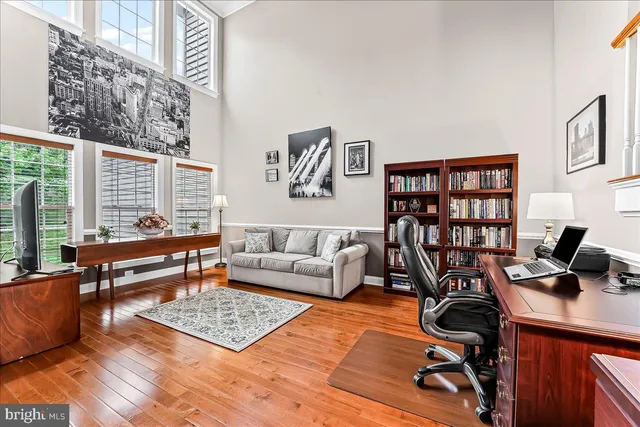 a living room with furniture rug and window