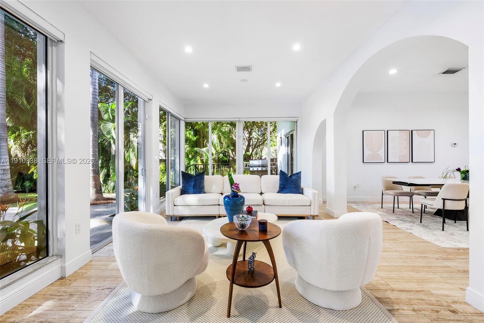 6300 Allison Road Miami Beach, FL 33141 - Photo 11 of 43 a living room with fireplace furniture and a large window