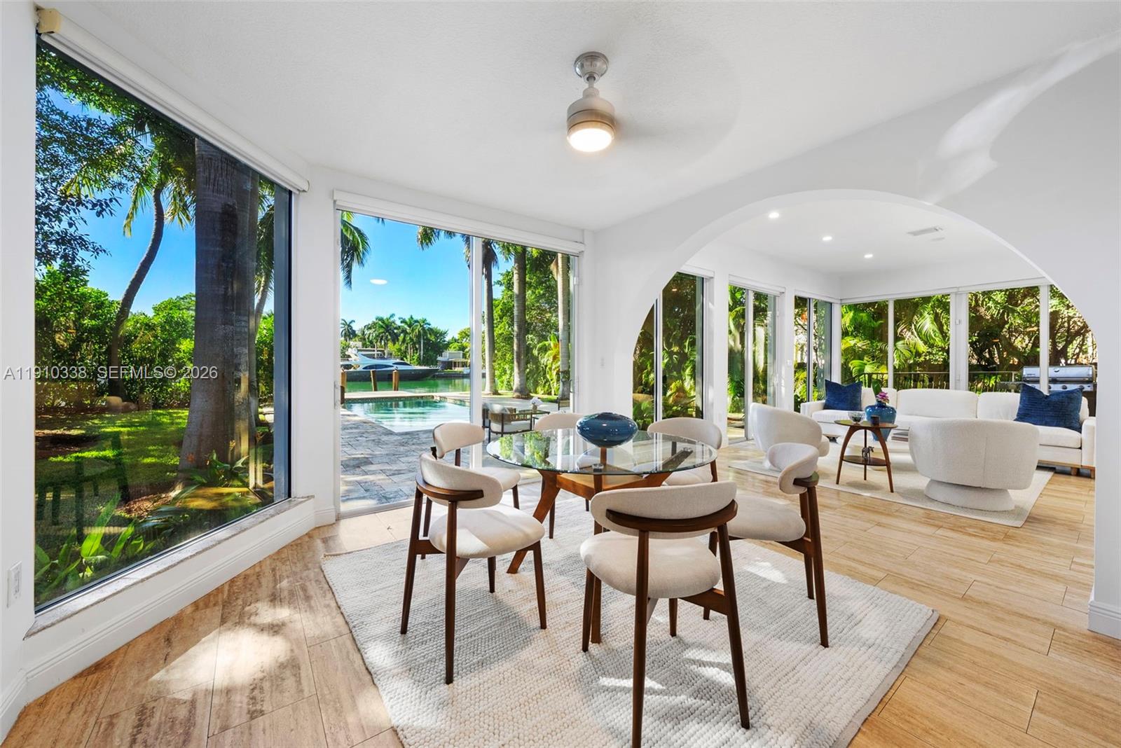 6300 Allison Road Miami Beach, FL 33141 - Photo 17 of 43 a view of a dining room with furniture window and outside view