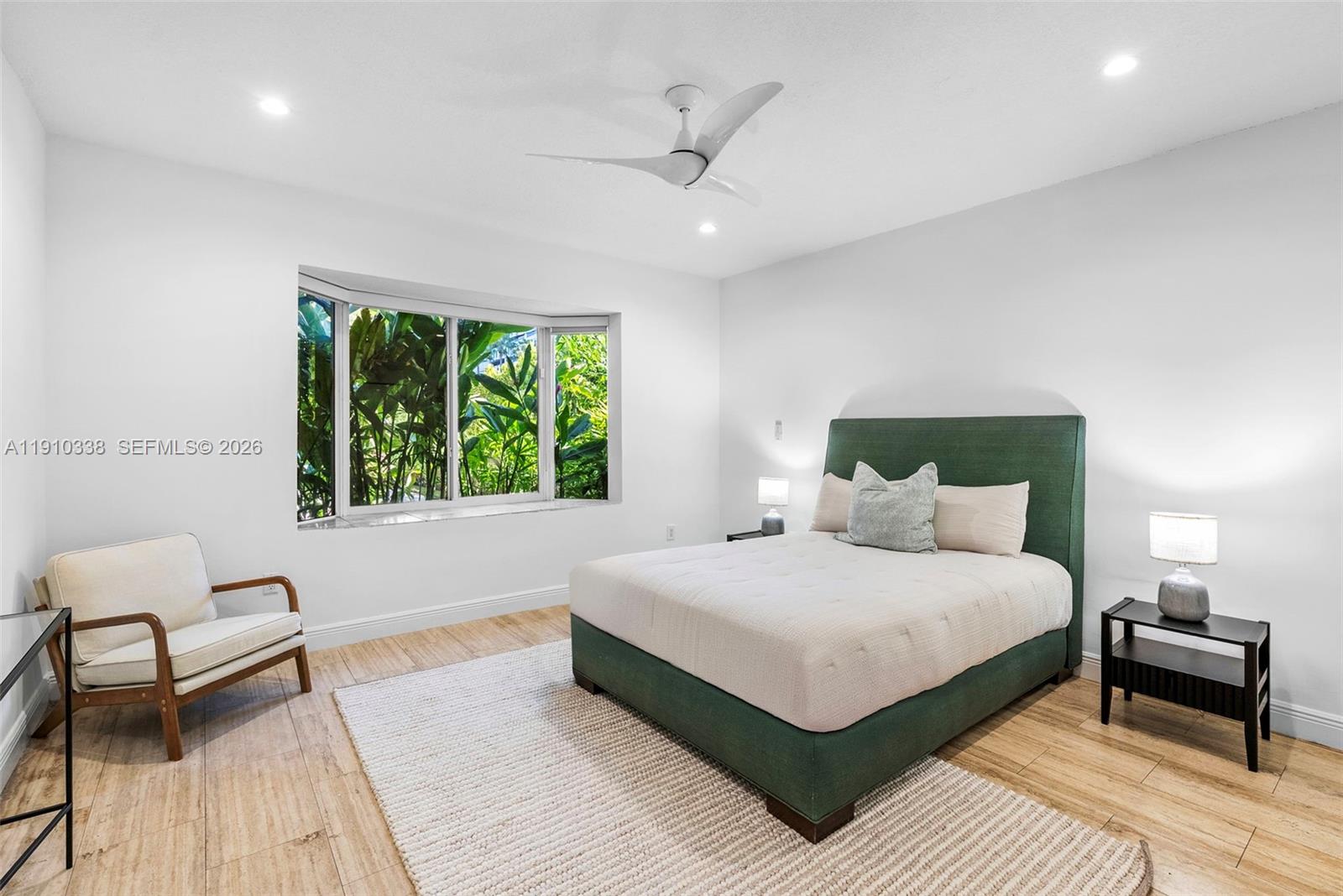 6300 Allison Road Miami Beach, FL 33141 - Photo 28 of 43 a bedroom with a large bed and a window