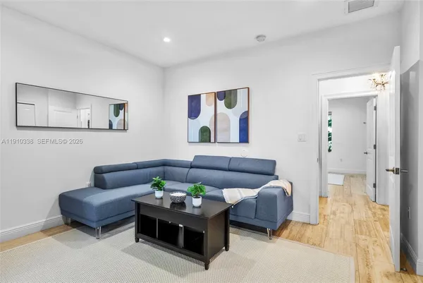 a living room with furniture and a rug