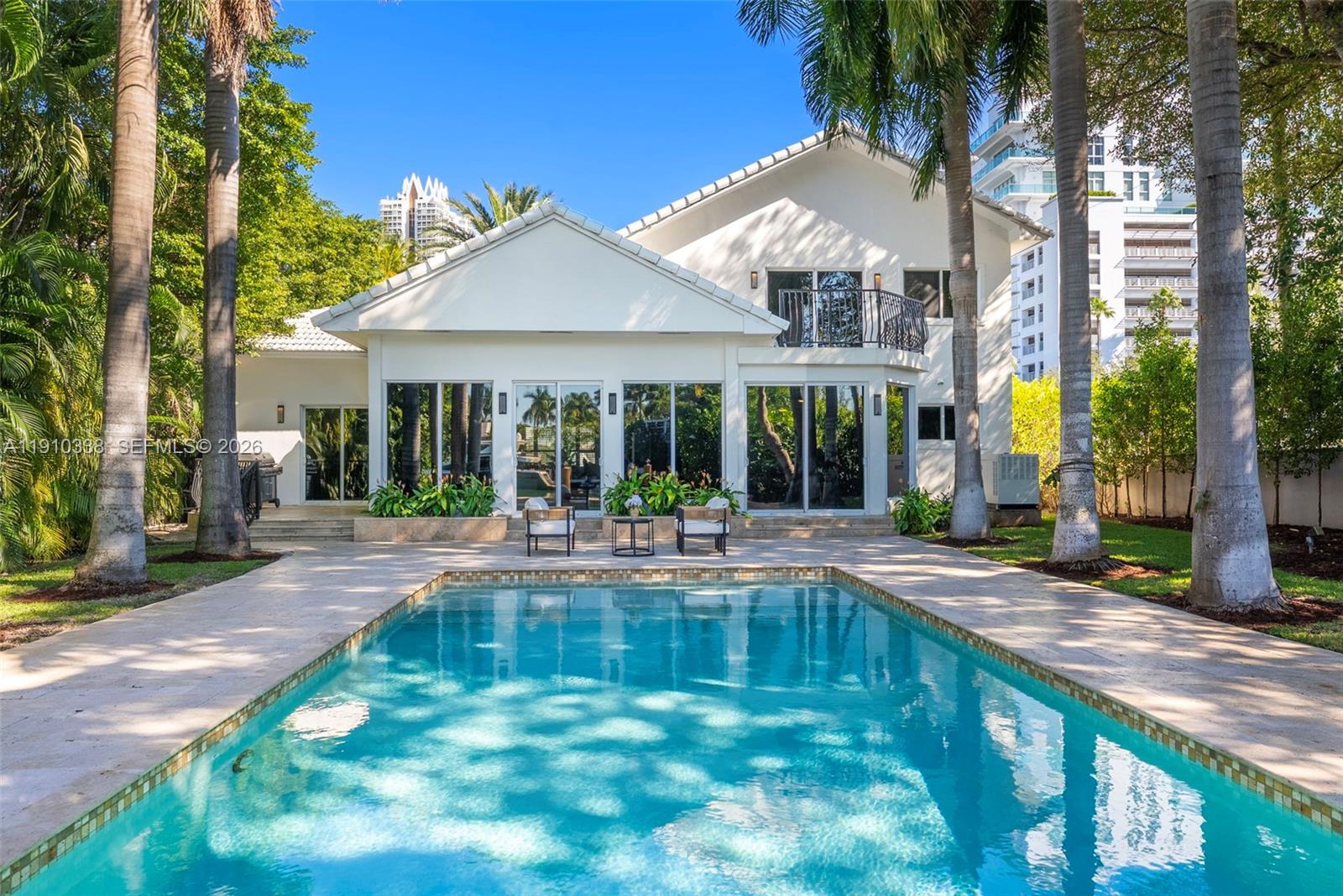 6300 Allison Road Miami Beach, FL 33141 - Photo 36 of 43 a view of a house with sitting area and a swimming pool