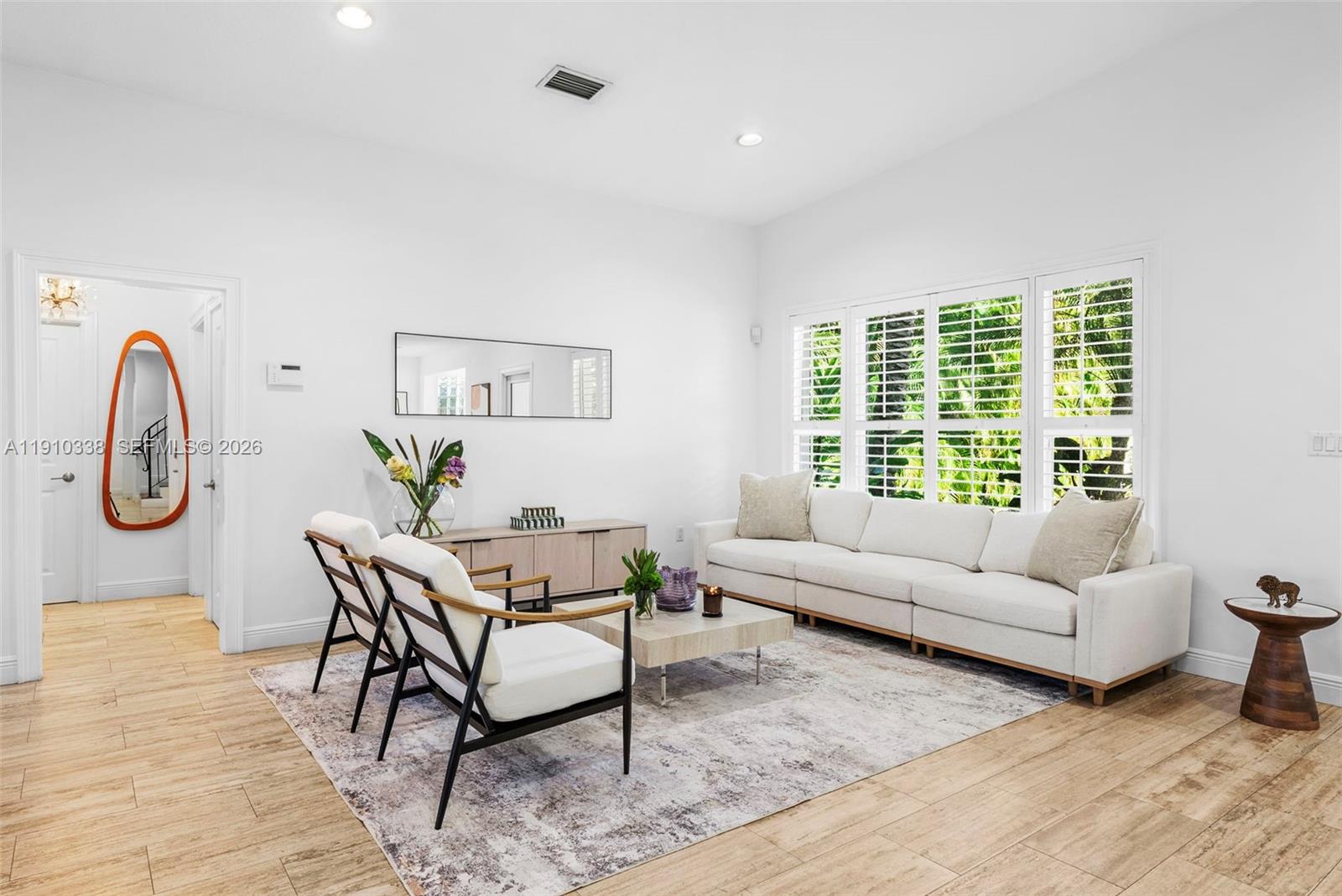 6300 Allison Road Miami Beach, FL 33141 - Photo 9 of 43 a living room with furniture a window and a potted plant