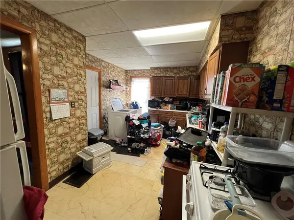 a bed room with furniture and a flat screen tv