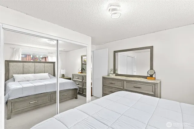 a bedroom with a bed and a dresser