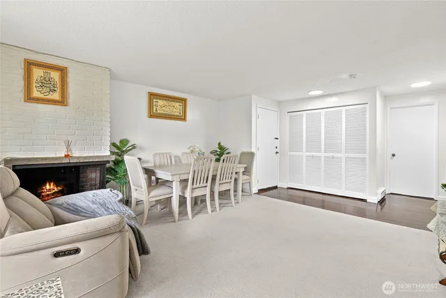 a living room with furniture a window and a fireplace