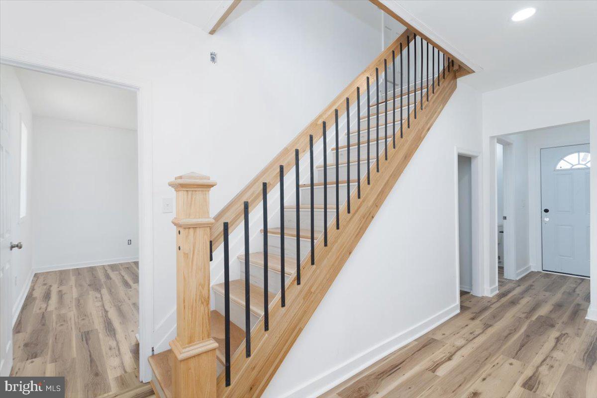 5026 Bethlehem Road Preston, MD 21655 - Photo 15 of 25 a view of a hallway with wooden floor and entryway