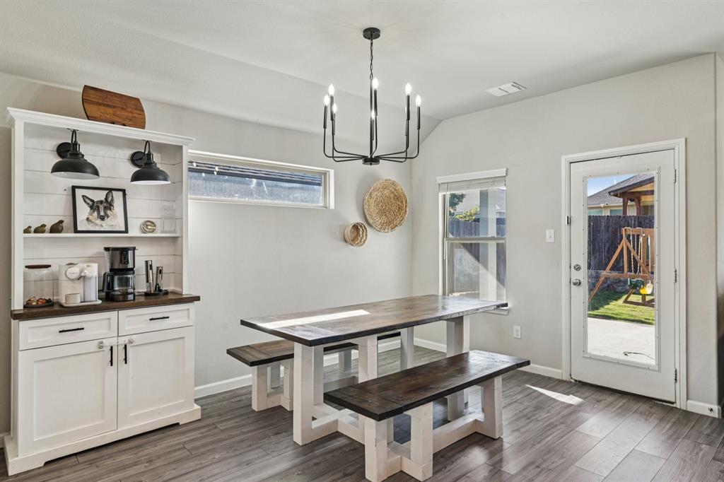 312 Scenic Point Drive Princeton, TX 75407 - Photo 12 of 40 a room with cabinets and wooden floor