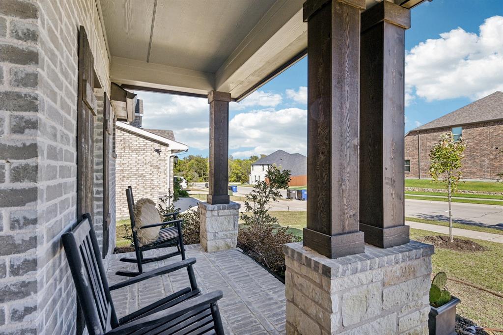 312 Scenic Point Drive Princeton, TX 75407 - Photo 2 of 40 a living room with furniture and a floor to ceiling window
