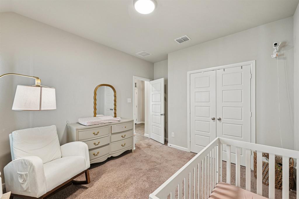 312 Scenic Point Drive Princeton, TX 75407 - Photo 20 of 40 a bedroom with furniture and a window