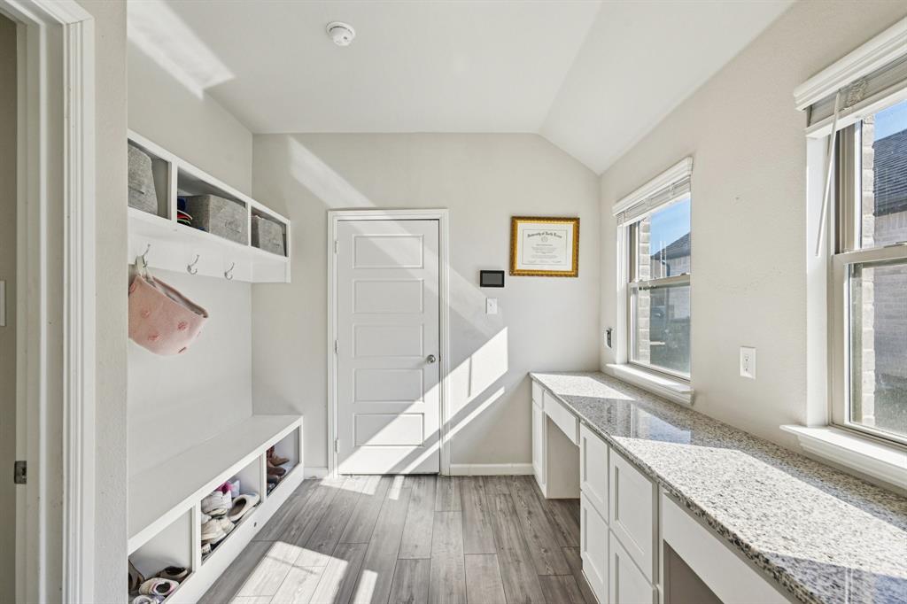 312 Scenic Point Drive Princeton, TX 75407 - Photo 21 of 40 a view of a kitchen with furniture and wooden floor