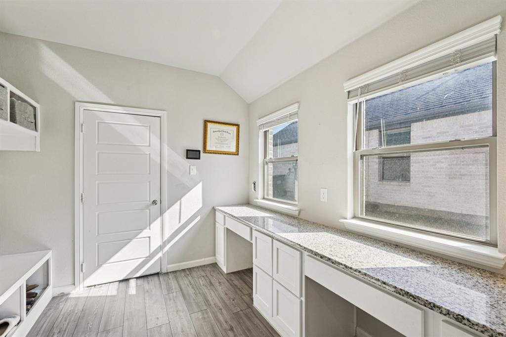 312 Scenic Point Drive Princeton, TX 75407 - Photo 22 of 40 a view of a kitchen cabinets and wooden floor