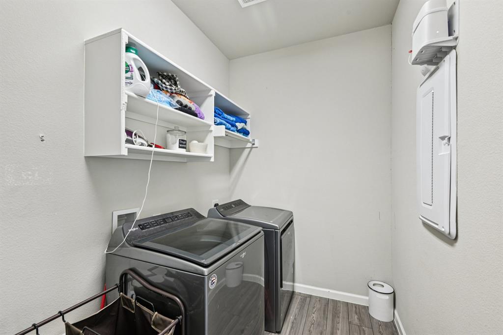 312 Scenic Point Drive Princeton, TX 75407 - Photo 24 of 40 a utility room with dryer and washer