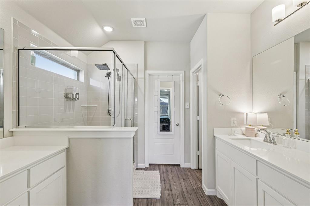 312 Scenic Point Drive Princeton, TX 75407 - Photo 28 of 40 a bathroom with a shower sink and mirror