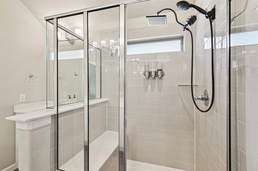 312 Scenic Point Drive Princeton, TX 75407 - Photo 32 of 40 a bathroom with a glass shower door