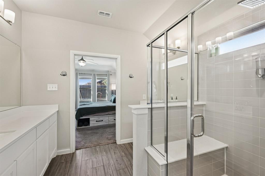 312 Scenic Point Drive Princeton, TX 75407 - Photo 33 of 40 a bathroom with a shower and a sink