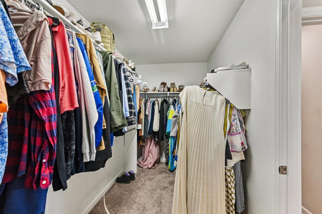 312 Scenic Point Drive Princeton, TX 75407 - Photo 34 of 40 a view of walk in closet with clothes