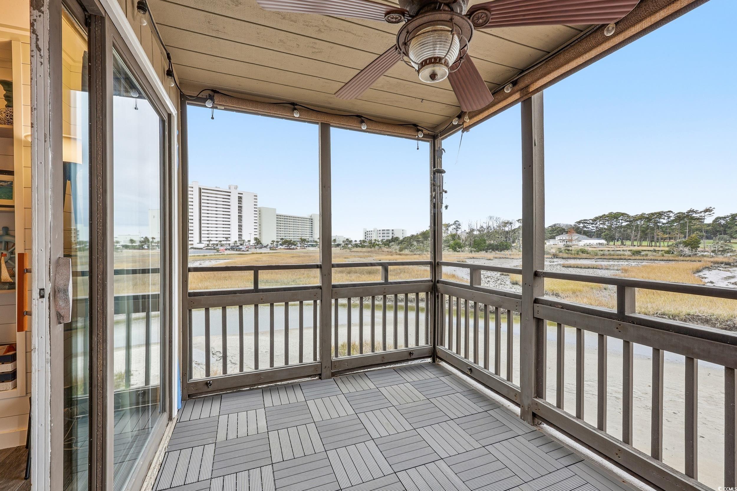 9501 Shore Drive, Unit A208 Myrtle Beach, SC 29572 - Photo 14 of 29 Unfurnished sunroom featuring ceiling fan and healthy amount of natural light