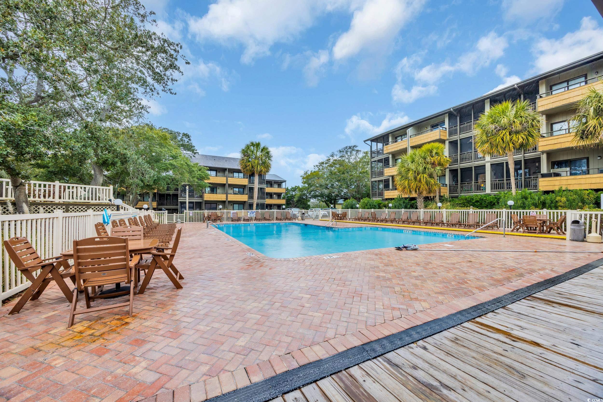 9501 Shore Drive, Unit A208 Myrtle Beach, SC 29572 - Photo 24 of 29 Community pool with a patio area