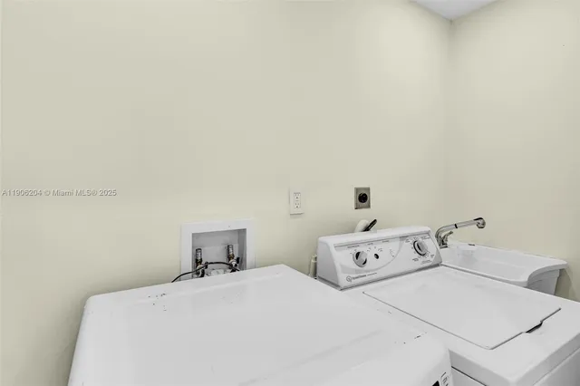 a room with a bed and white cabinet