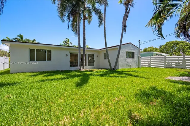an aerial view of residential building and ocean