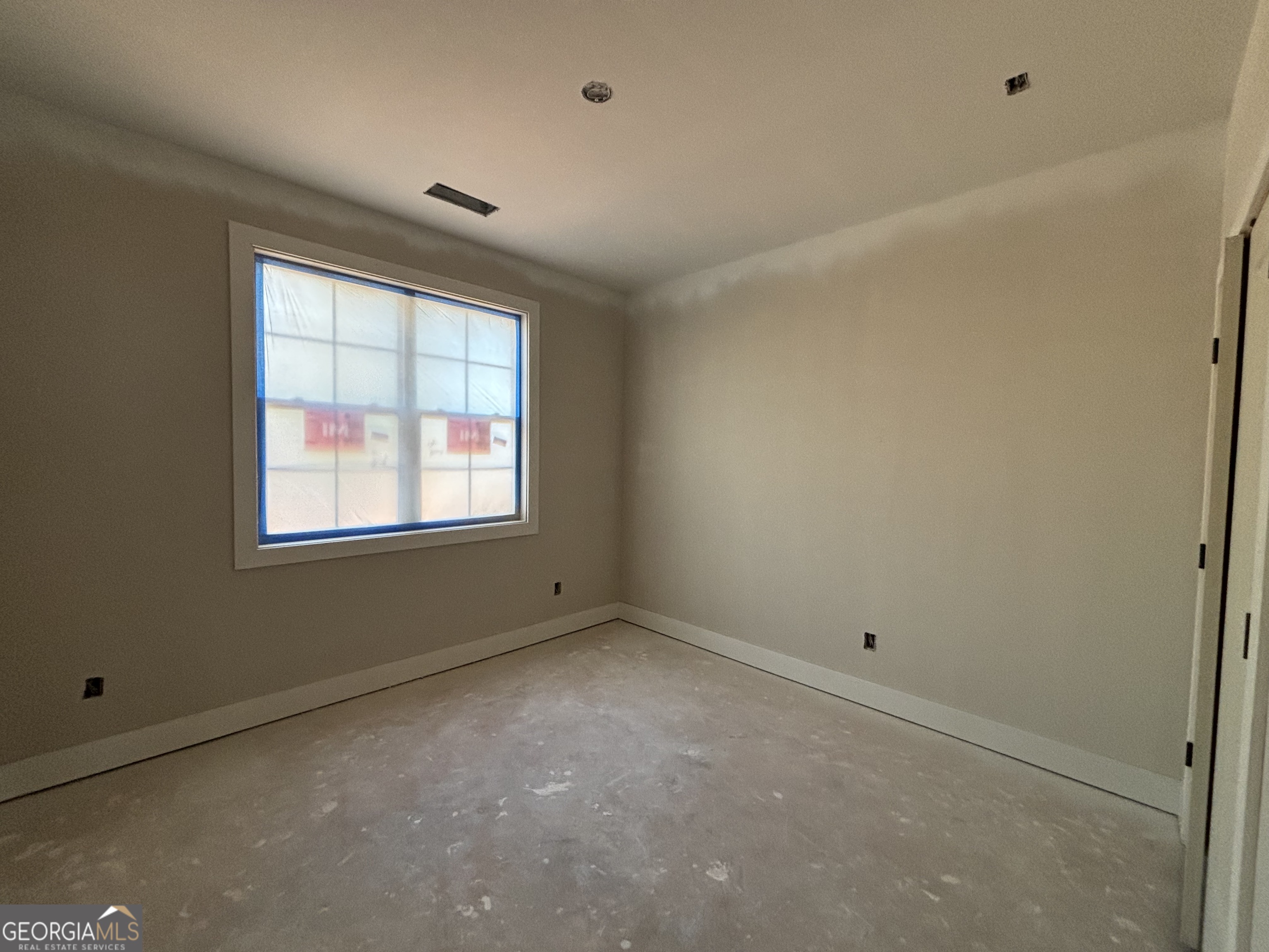 243 Copper Crossing Forsyth, GA 31029 - Photo 11 of 17 an empty room with windows