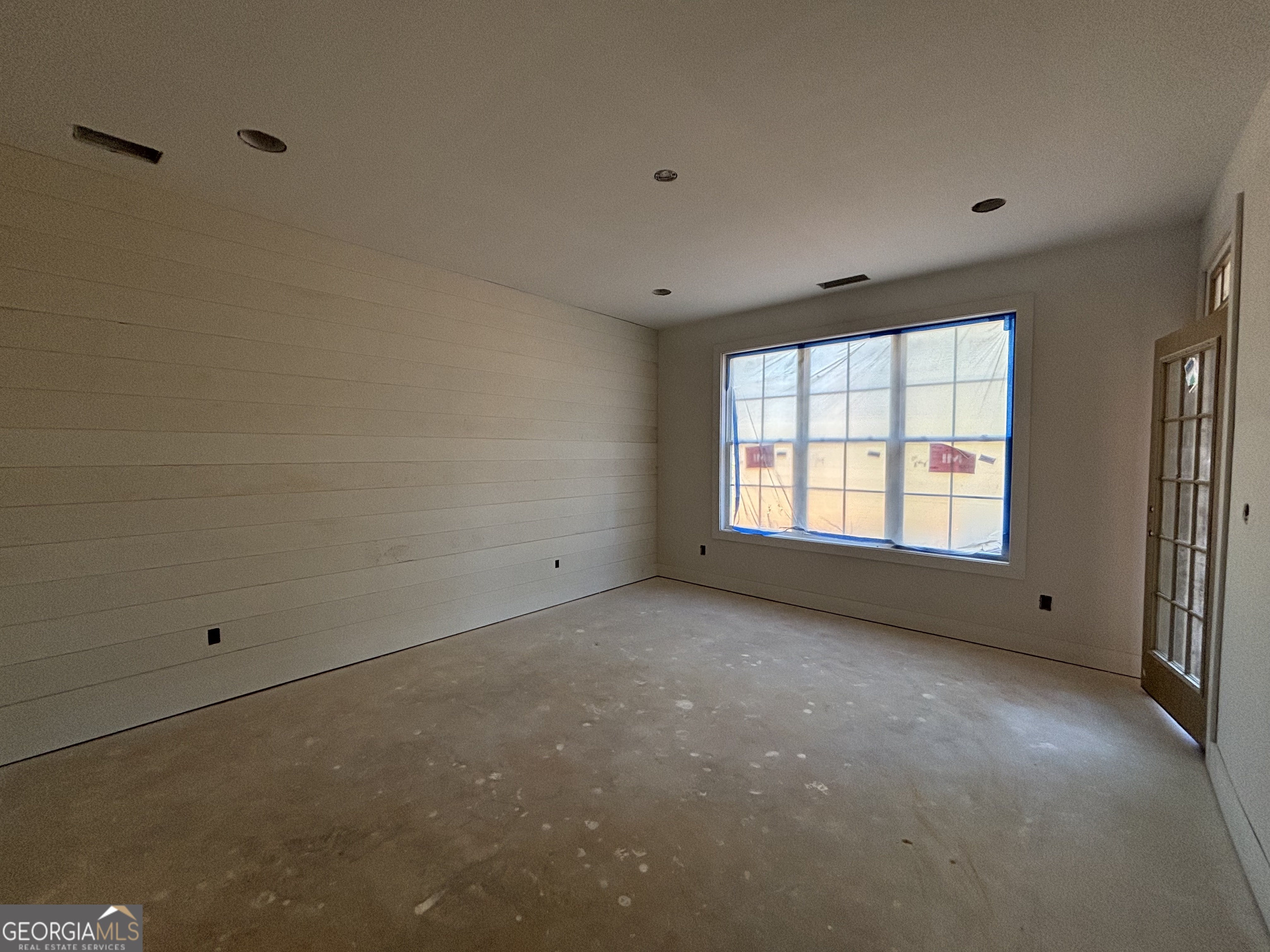 243 Copper Crossing Forsyth, GA 31029 - Photo 13 of 17 a view of an empty room with a window